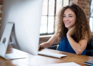 Woman sitting in front of a laptop