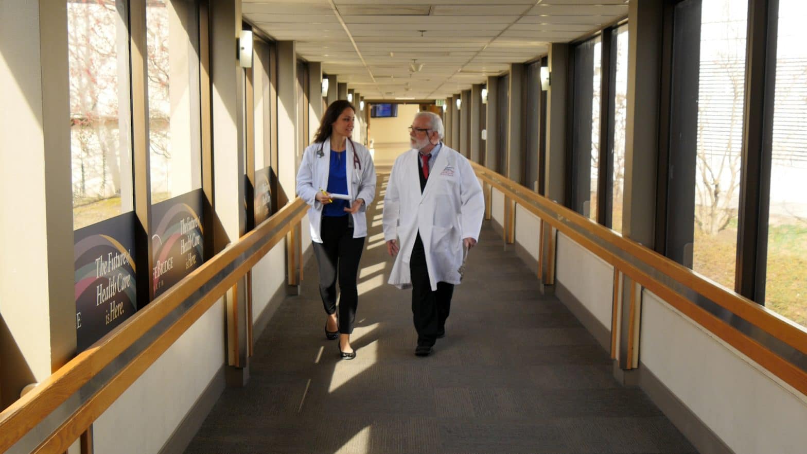 Trinity medical school faculty walking through campus