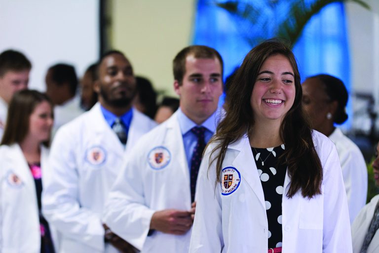 Trinity medical school academics students in a line