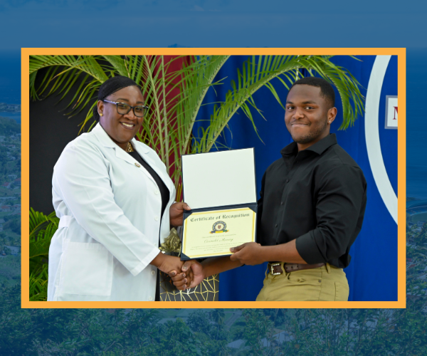 Vincentian grad holding up award are Trinity's White Coat Ceremony