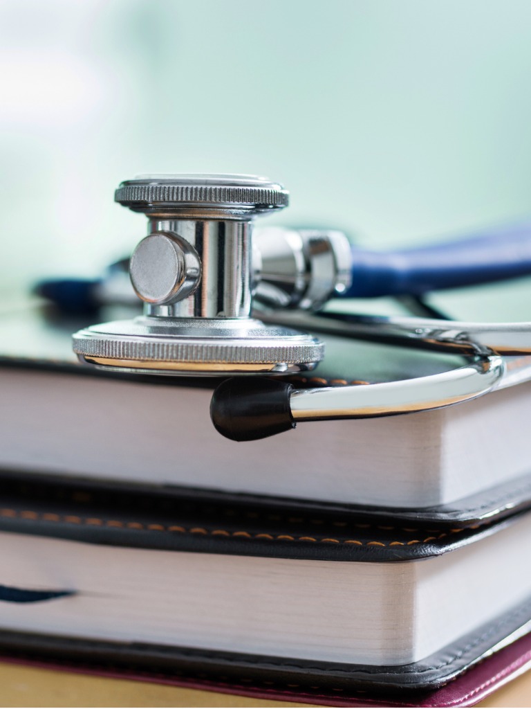 medical school accreditation stethoscope and books